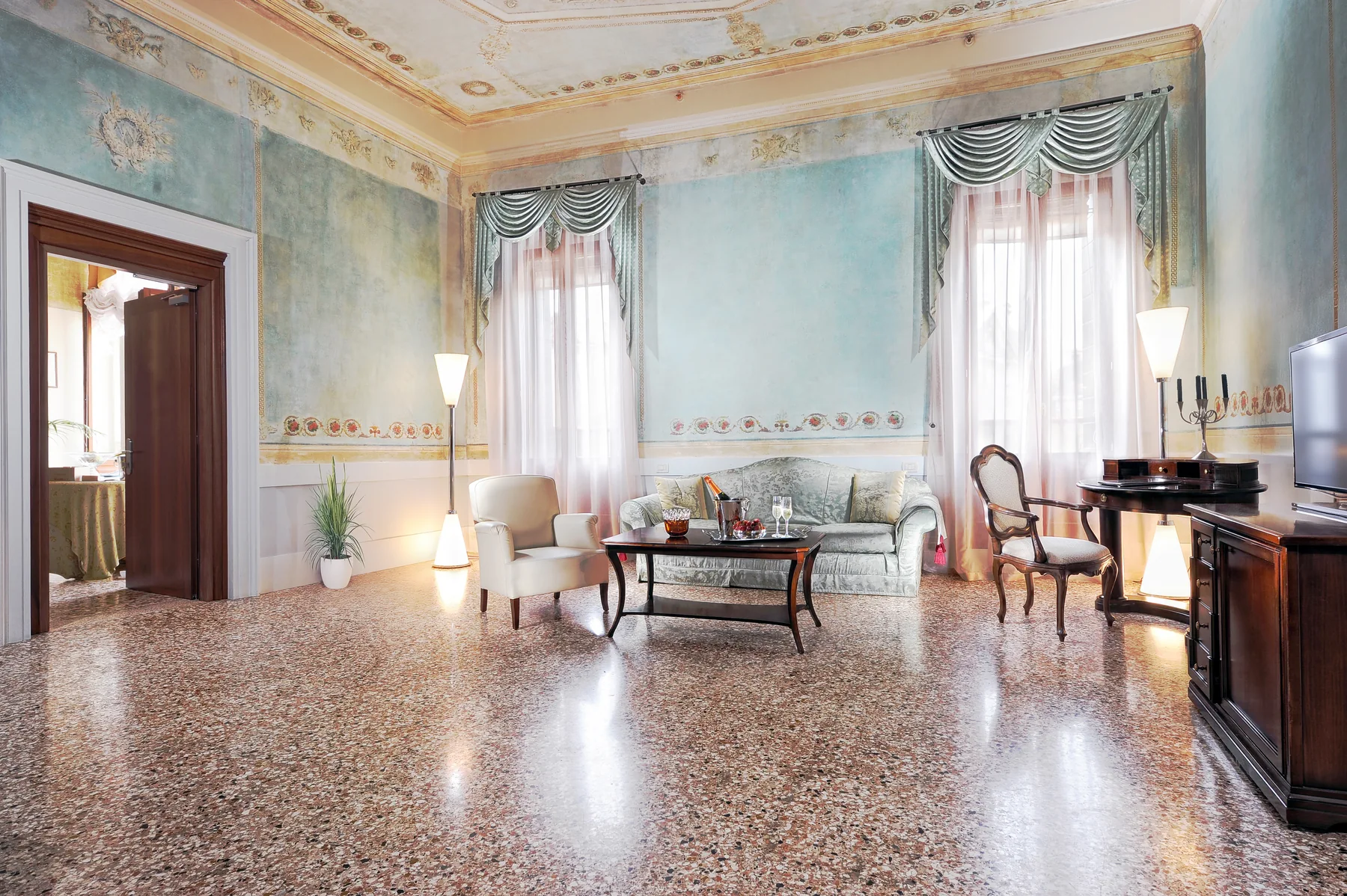 The frescoed lounge of the Suite at Palazzo Vitturi with Venetian terrazzo floor
